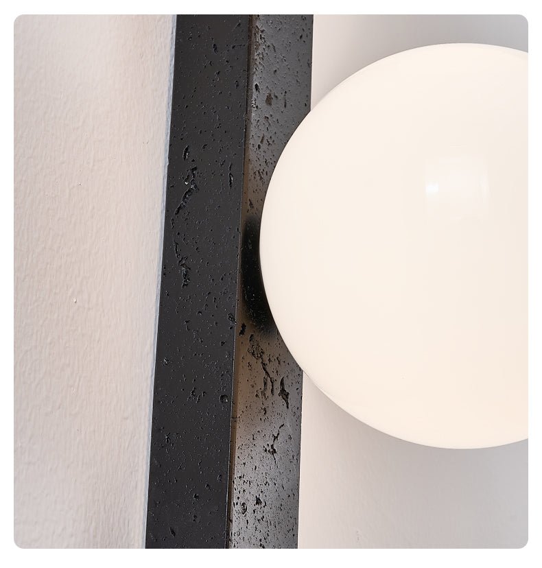 Zoshaira bollen Zwart travertin wandlamp