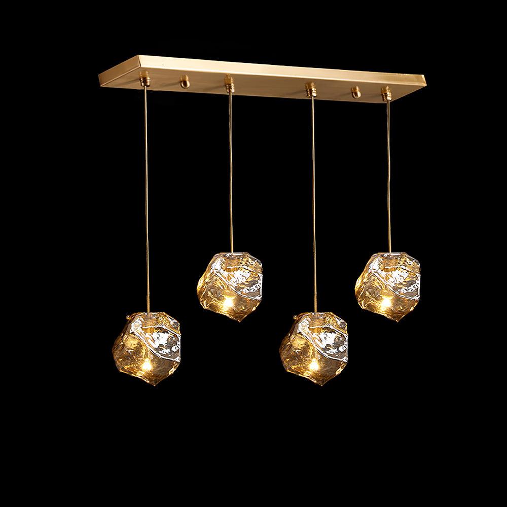 Kixu Luxe hanglamp van messing met amberkleurige kap