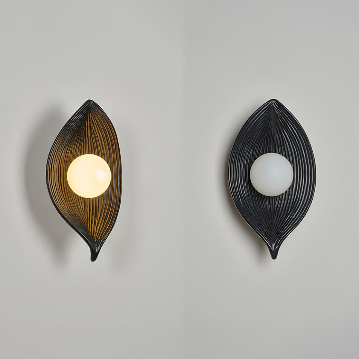 Lirixa wandlamp met bladmotief in hars en metaal