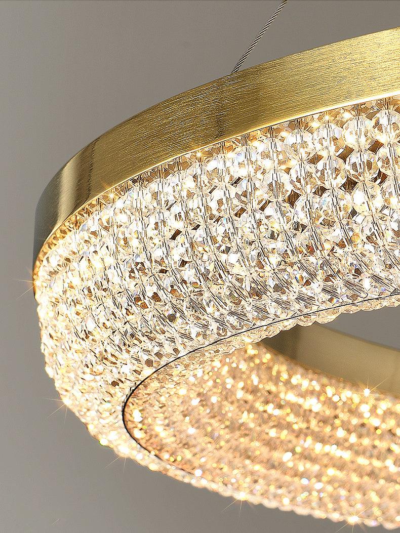 Cyrereon kroonluchter met ronde ringen van kristal in goudkleurige afwerking