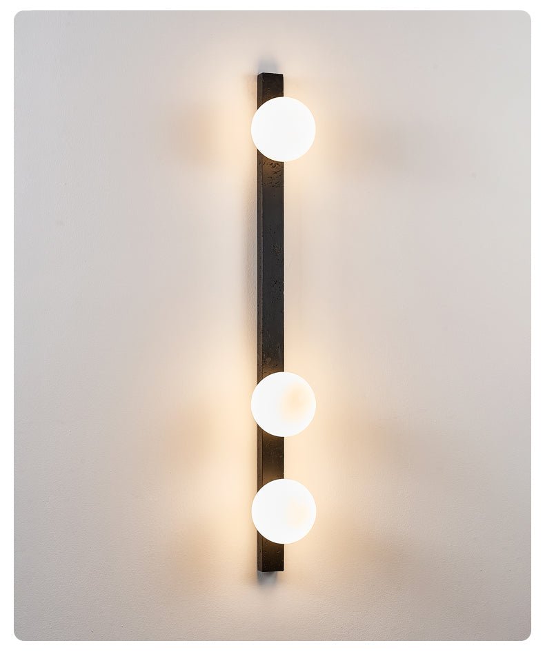 Zoshaira bollen Zwart travertin wandlamp