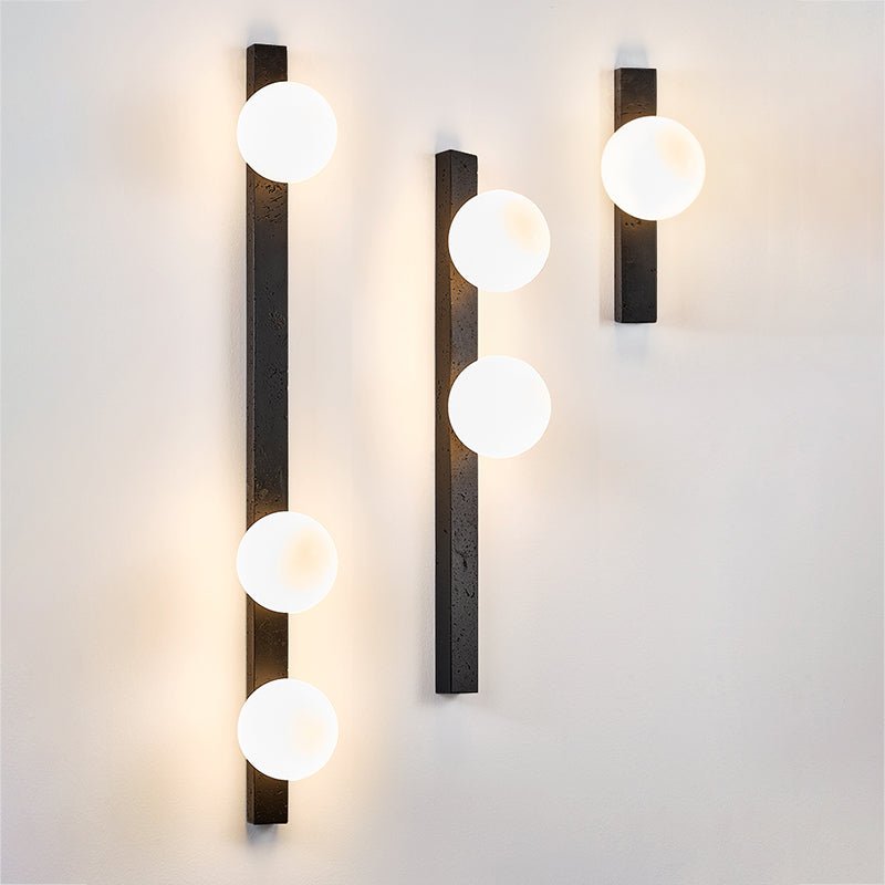 Zoshaira bollen Zwart travertin wandlamp