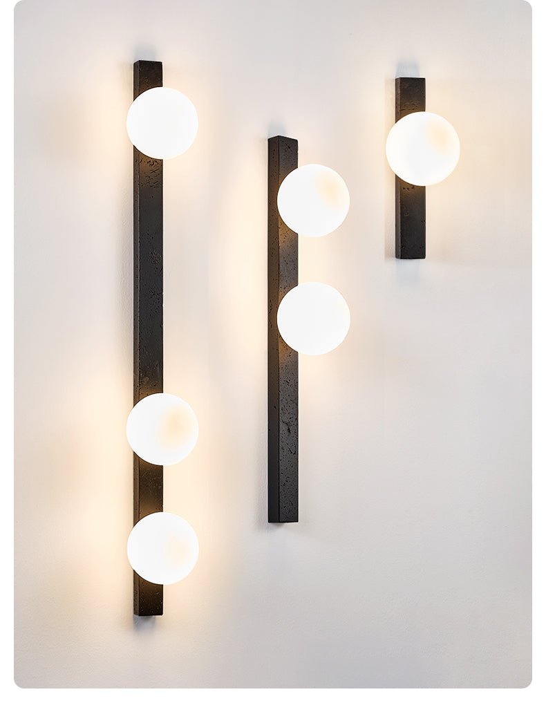 Zoshaira bollen Zwart travertin wandlamp