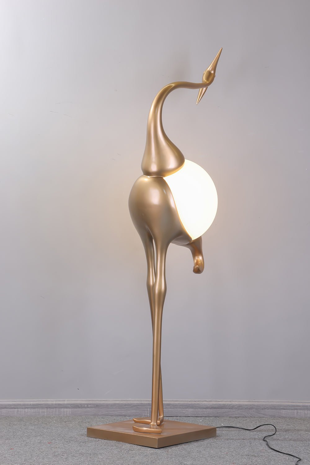 Uraearae wandlamp in vorm van een kraan