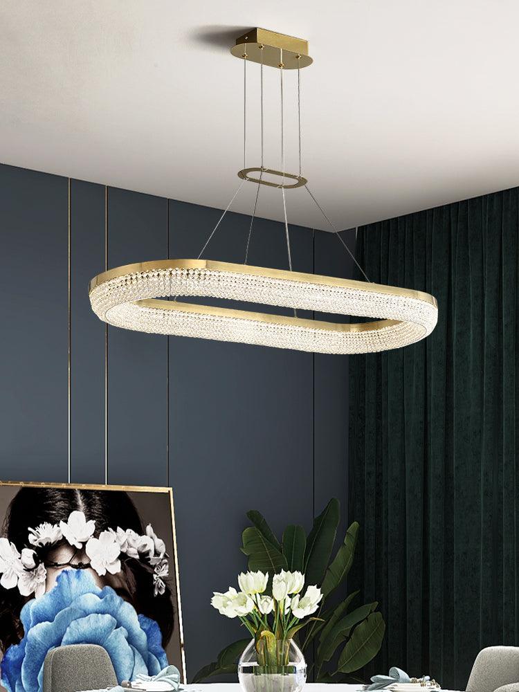 Cyrereon kroonluchter met ronde ringen van kristal in goudkleurige afwerking