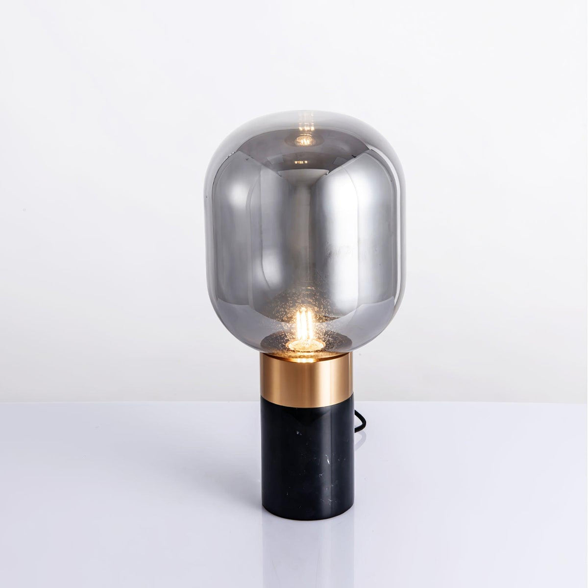 Aurdoren Minimalistische tafellamp met marmeren basis en cognac glas