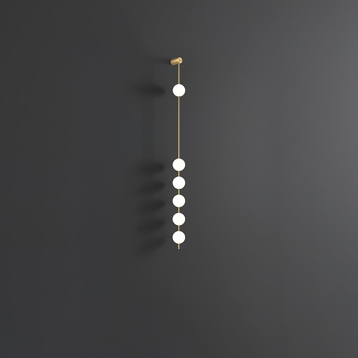 Soloiella wandlamp met verticale bollen van messing