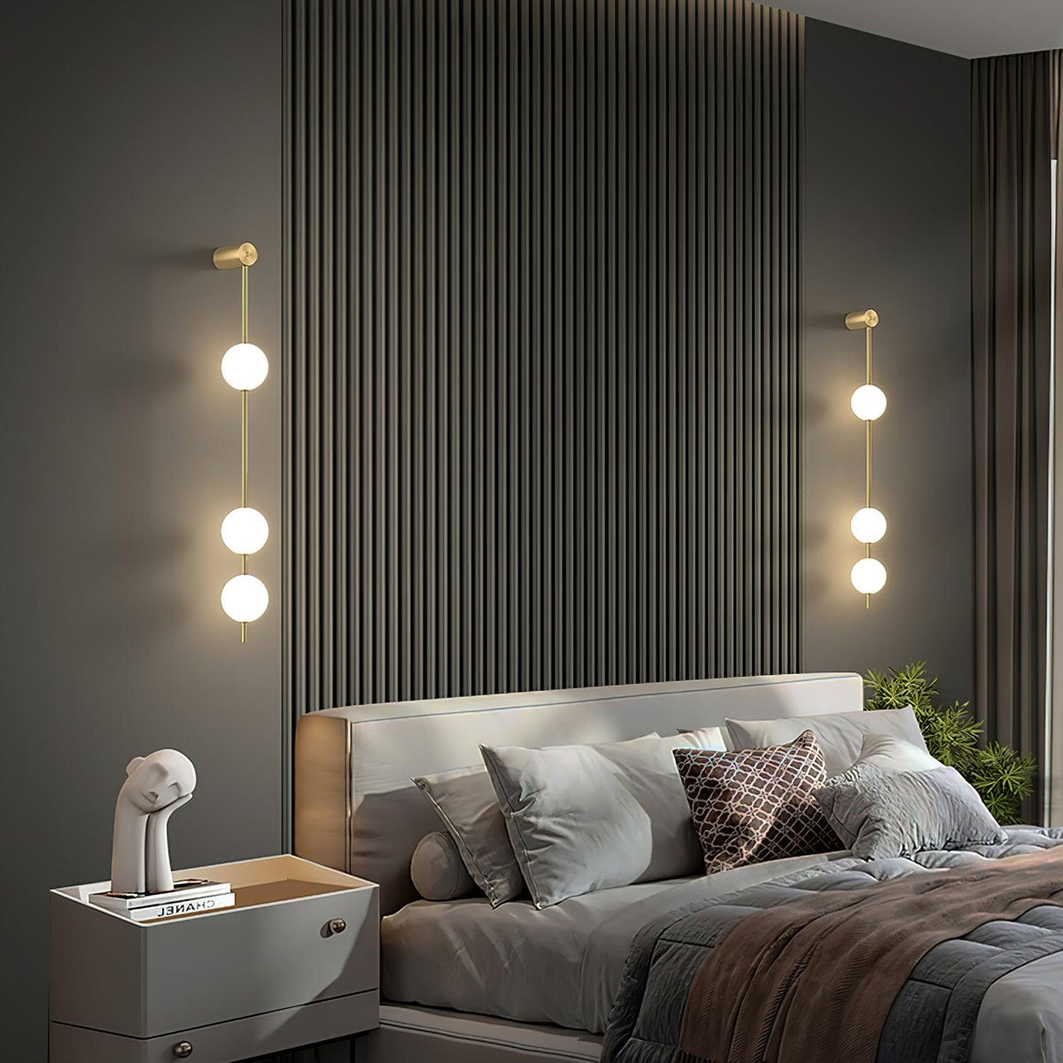 Soloiella wandlamp met verticale bollen van messing